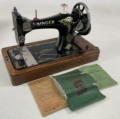 Lot 90 - A cased Singer sewing machine.