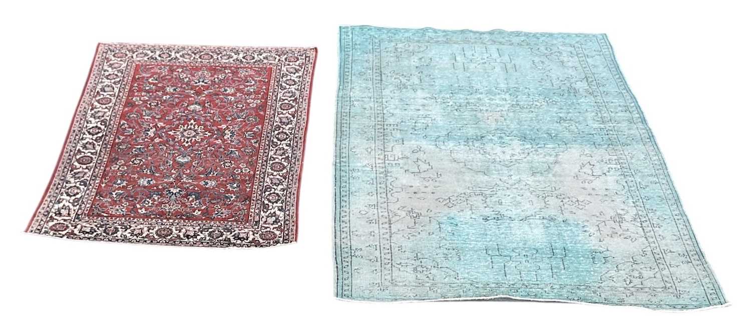 Lot 60 - A modern machine made Persian style red ground...