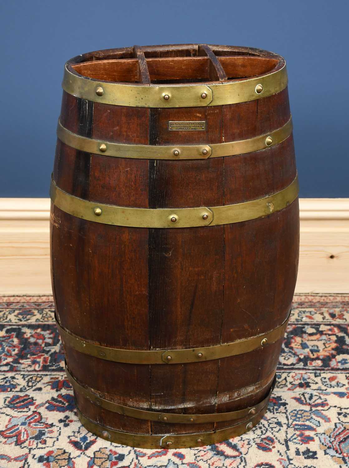 Lot 2818 - A brass bound teak barrel shaped stick stand,...