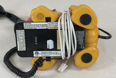 Lot 28 - DISNEY; a Pluto landline push button telephone,...