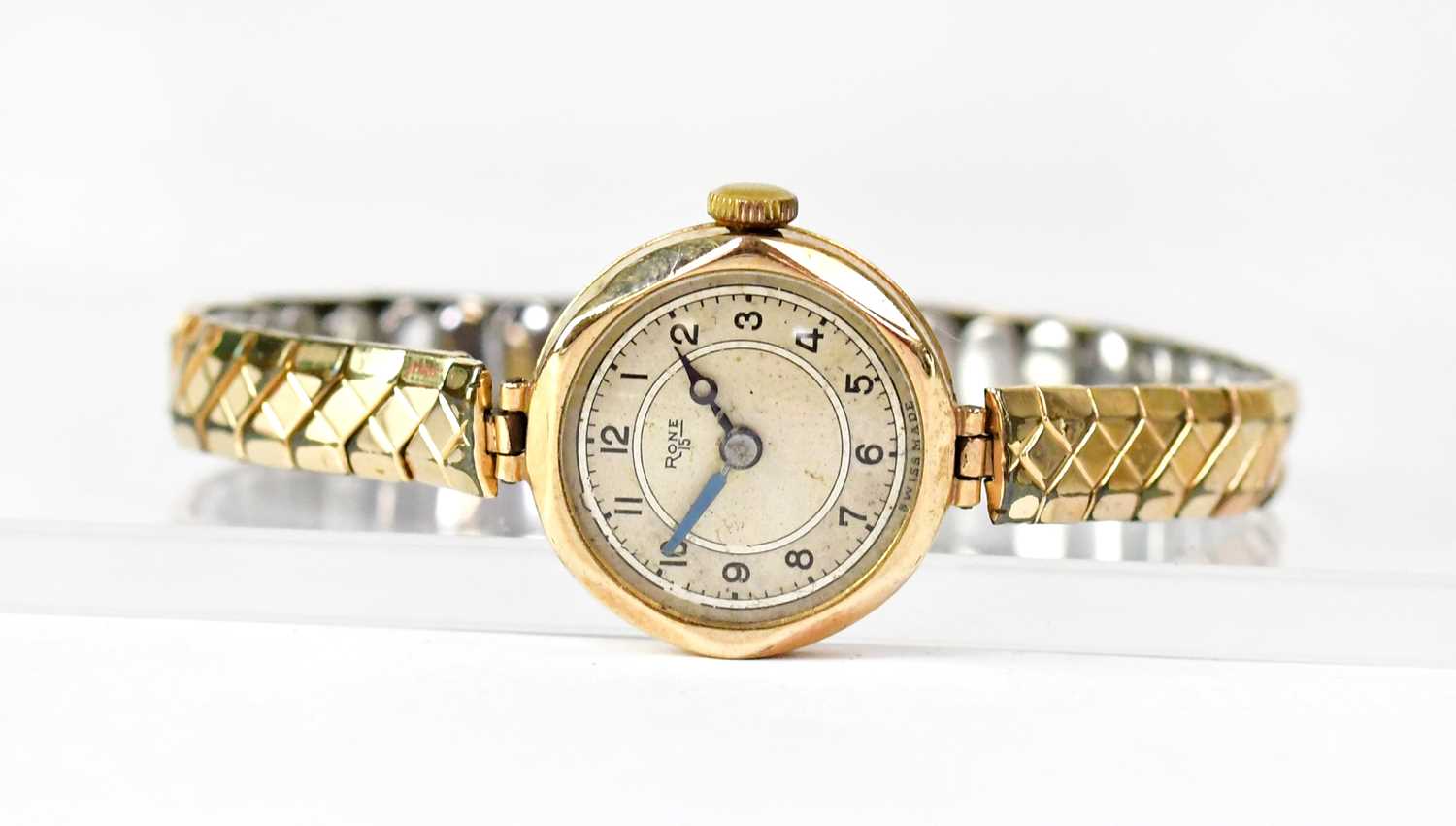 Lot 1172 - RONE; a 9ct yellow gold wristwatch, the