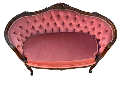 Lot 2123 - A Victorian carved walnut two seater salon...