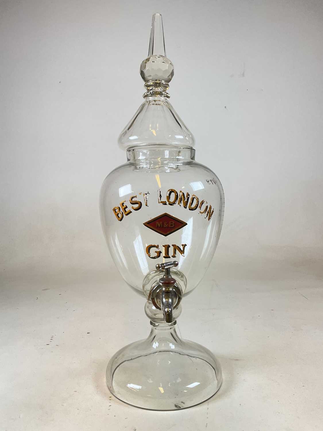 Lot 105 - A large advertising clear glass gin dispenser...