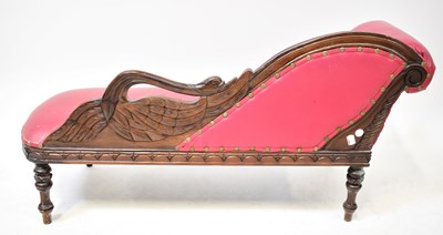 Lot 9 - A children's chaise longue with carved swan...
