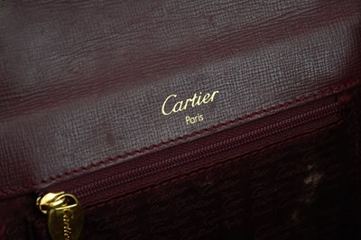Lot 680 - CARTIER; a Must de Cartier 2C logo red...