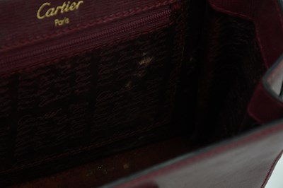 Lot 680 - CARTIER; a Must de Cartier 2C logo red...