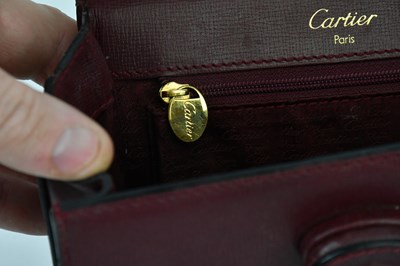 Lot 680 - CARTIER; a Must de Cartier 2C logo red...