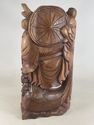 Lot 240 - A large carved wood merry monk figure, height...