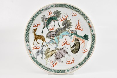 Lot 1056 - A Chinese Wucai wall charger, decorated with...