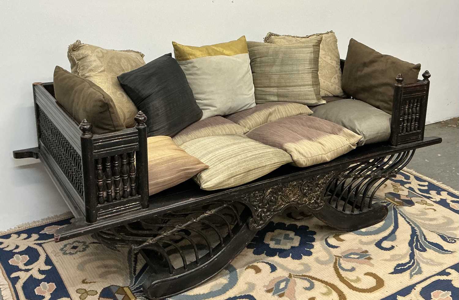 Lot 35 - An early 20th century Chinese ebonised day bed,...