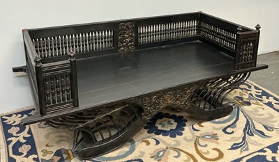 Lot 35 - An early 20th century Chinese ebonised day bed,...