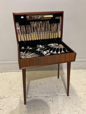 Lot 48 - A mid century teak table canteen containing...