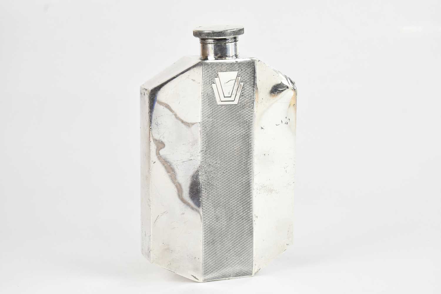 Lot 39 - An Art Deco silver plated hip flask of large...