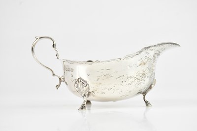 Lot 417 - ADIE & LOVEKIN; a hallmarked silver sauce boat,...
