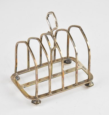 Lot 384 - An Edward VII hallmarked silver toast rack,...