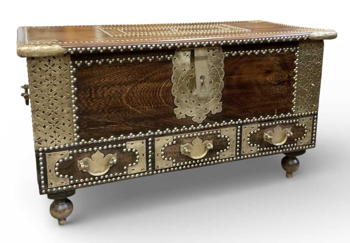 Lot 16 - A reproduction African carved hardwood...