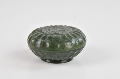 Lot 1006 - A 19th century Chinese carved jade circular...