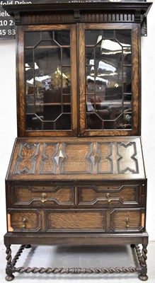 Lot 12 - An early 20th century oak bureau bookcase in...