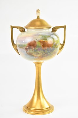 Lot 1274 - ROYAL WORCESTER; a twin handled pedestal vase...