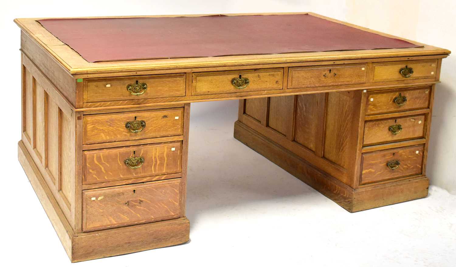 Lot 47 - An Edwardian oak partners' desk, with an...