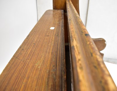 Lot 2 - A pitch pine church pew with panelled back,...