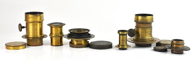 Lot 489 - A collection of six unmarked brass lenses,...