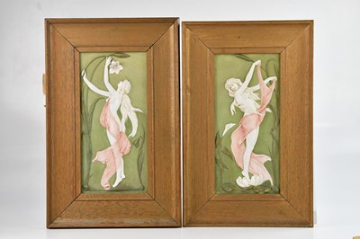 Lot 1302 - A pair of Art Nouveau painted bisque wall...