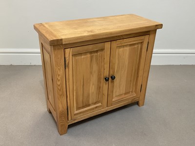 Lot 2129 - A modern light oak sideboard with two panelled...