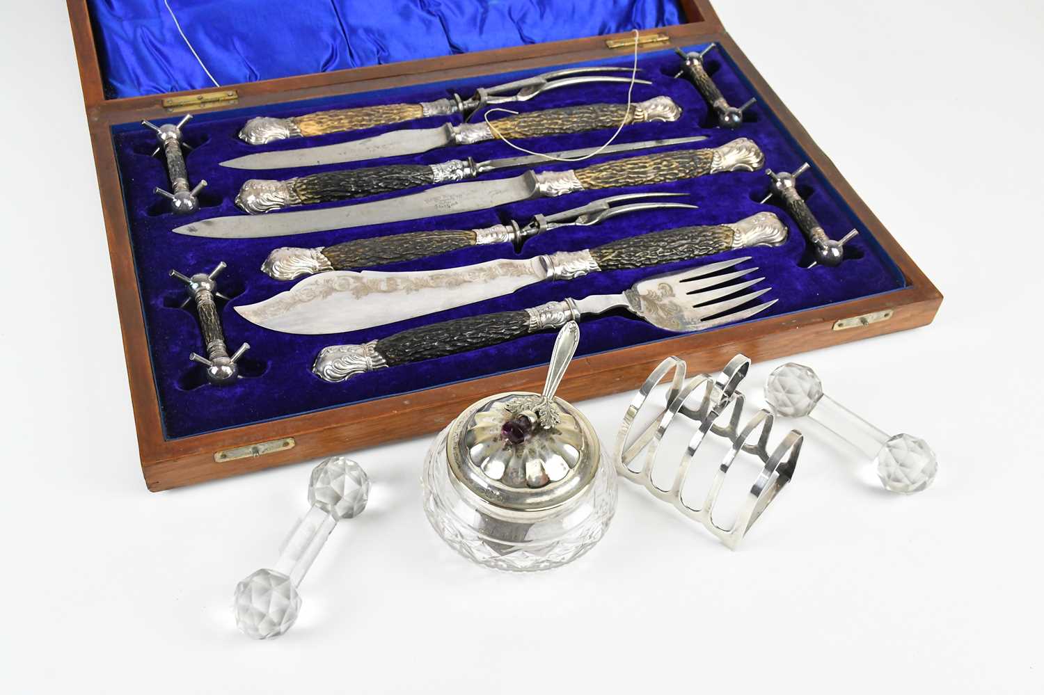 Lot 37 - An oak cased carving set, with knife rests and...