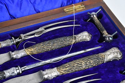 Lot 37 - An oak cased carving set, with knife rests and...