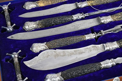 Lot 37 - An oak cased carving set, with knife rests and...