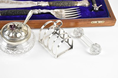 Lot 37 - An oak cased carving set, with knife rests and...