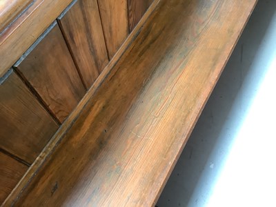 Lot 4 - A pitch pine church pew with Gothic-style ends,...