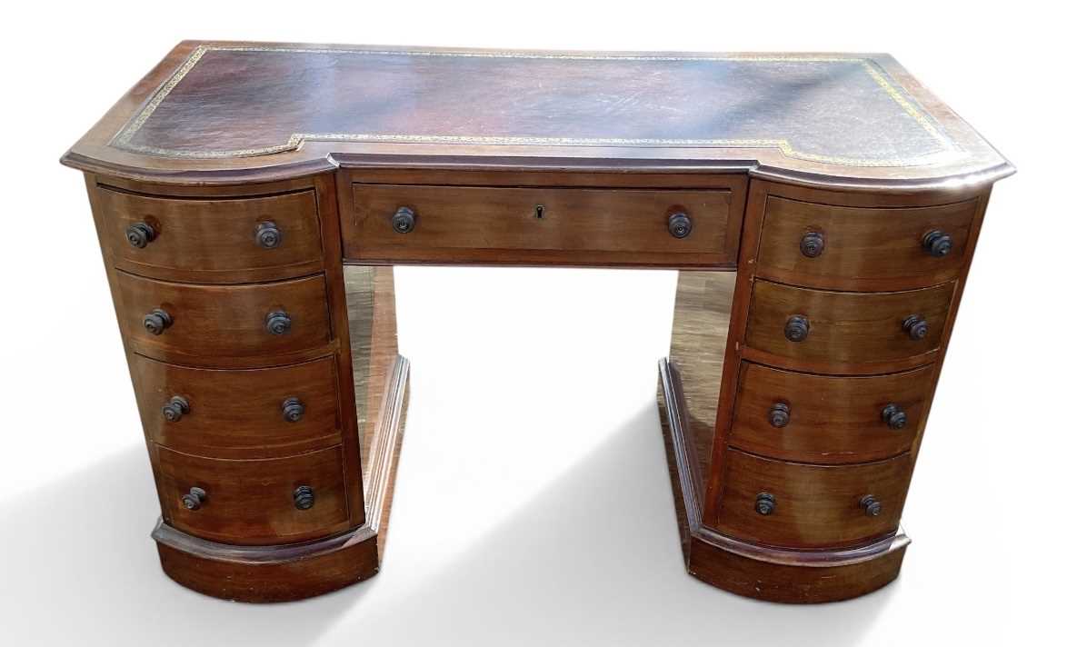 Lot 40 - A late Victorian mahogany kneehole desk, with...