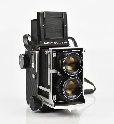 Lot 479 - MAMIYA; a C220 medium format film camera...