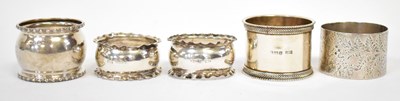 Lot 756 - Five hallmarked silver napkin rings, various...