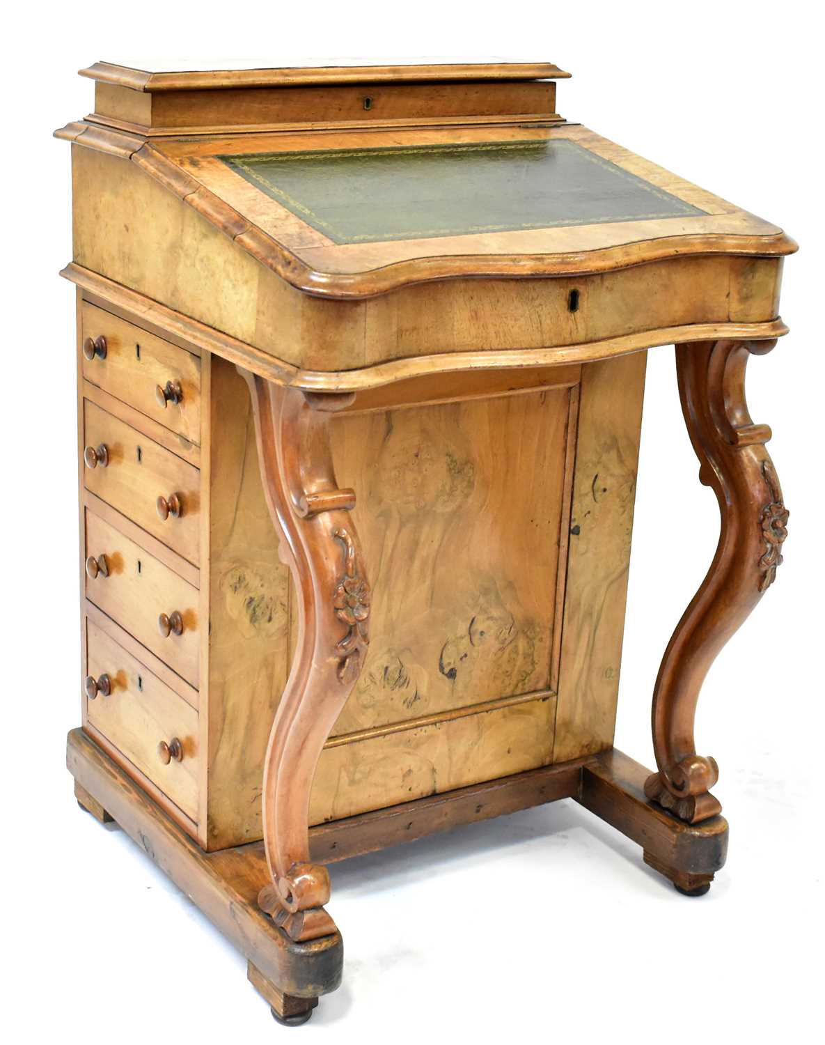 Lot 37 - A Victorian walnut Davenport with four...