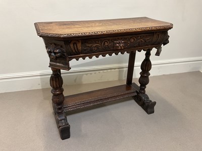 Lot 2035 - A 19th century carved oak hall table, with...