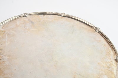 Lot 5 - A large metal salver, with heavily rubbed...