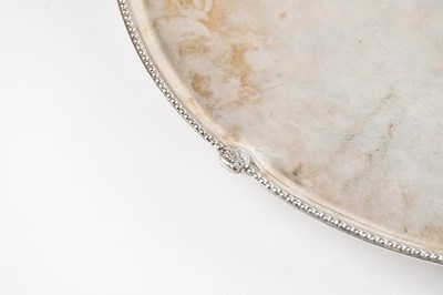 Lot 5 - A large metal salver, with heavily rubbed...