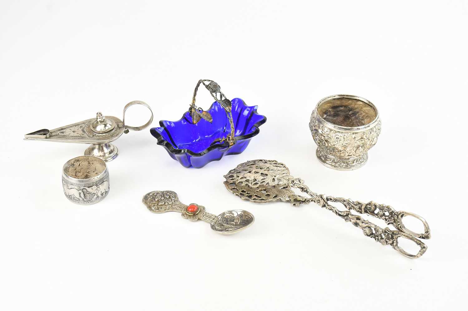Lot 10 - An Indian white metal bowl decorated with...
