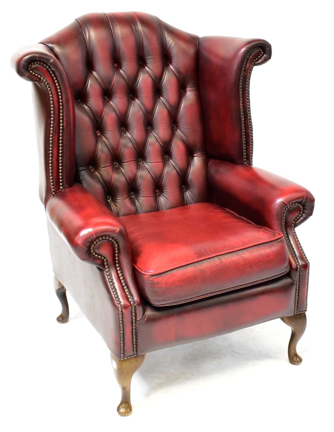 Lot 19 - A contemporary oxblood red leather button...