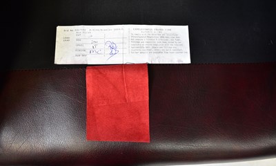 Lot 19 - A contemporary oxblood red leather button...
