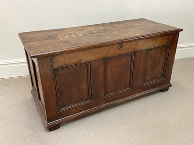 Lot 2007 - An 18th century panelled oak coffer on block...