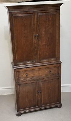 Lot 2030 - An early 20th century oak secretaire bookcase,...