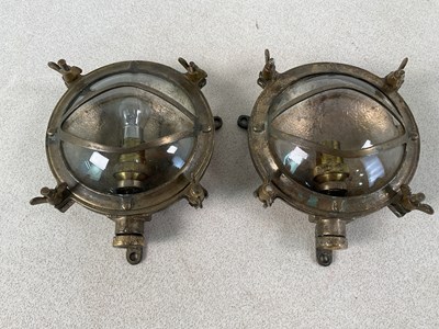 Lot 148 - B&L LTD; a pair of brass bulk head lights,...