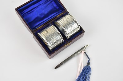 Lot 438 - A pair of Victorian hallmarked silver napkin...