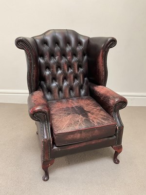 Lot 2096 - A reproduction brown leather Chesterfield wing...