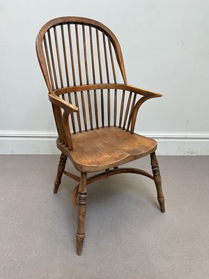 Lot 2009 - A 19th century elm seated Windsor elbow chair...