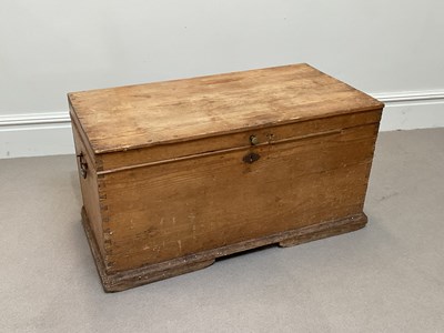Lot 2012 - An old pine blanket chest with hinged cover on...